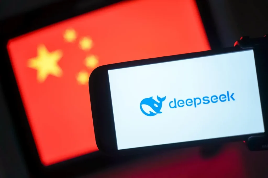 DeepSeek logo is on a phone in front of a flag